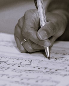 someone writing sheet music